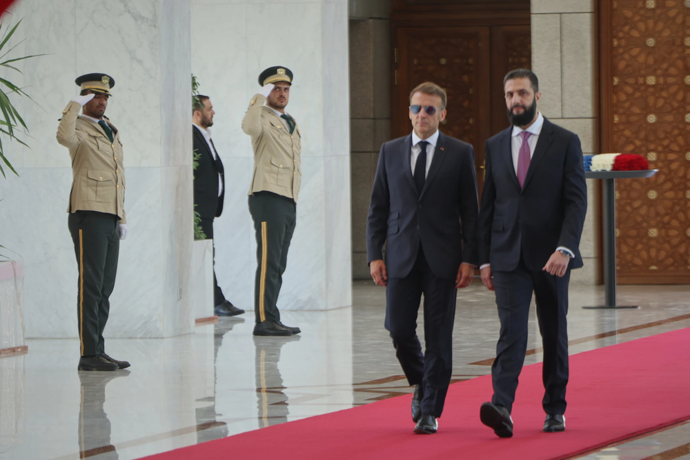What benefit does Macron's trip to Syria hold for the Kurds?