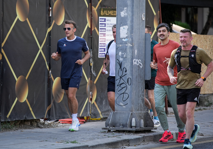 Macron Runs Along Iran Street