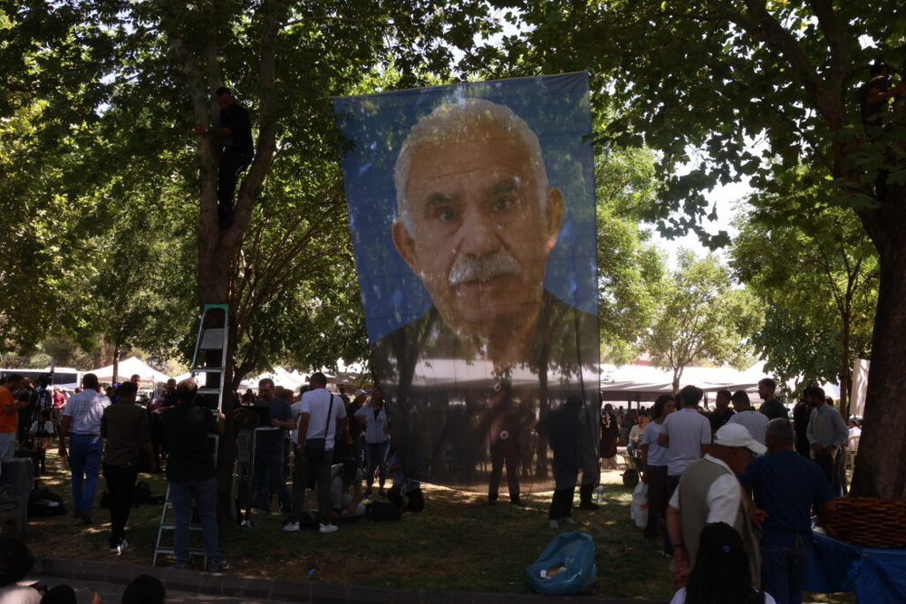Large images of Öcalan installed at the memorial ceremony for PKK martyrs in Diyarbakir